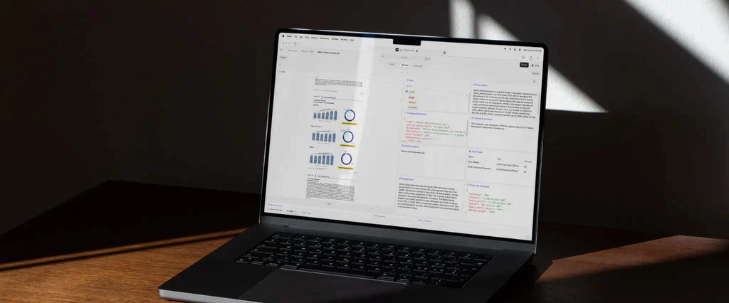 Laptop displaying financial data and charts.