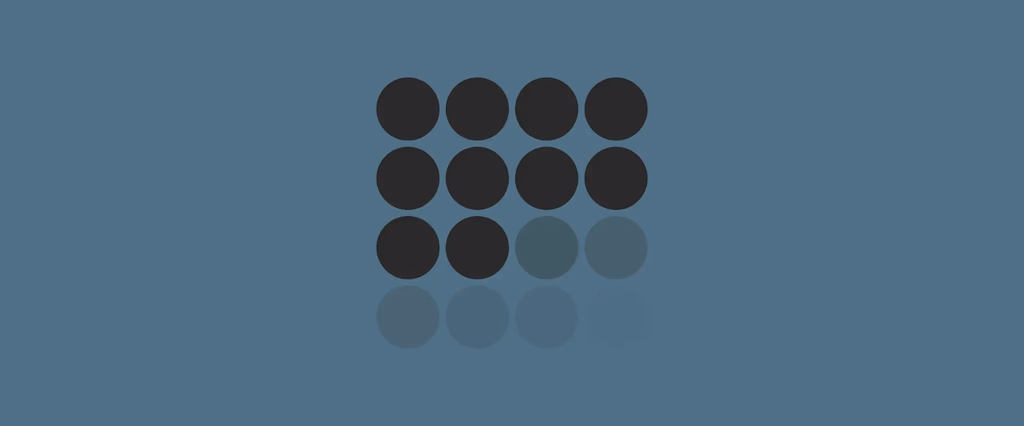 Grid of 12 dark gray circles with reflections