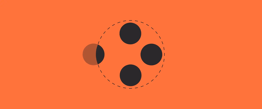 Four black dots in a circle on orange