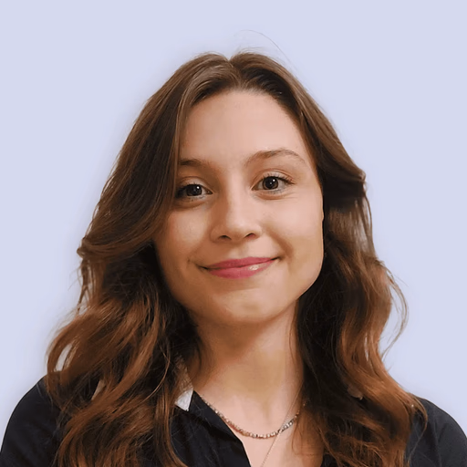 Woman with brown hair smiling.