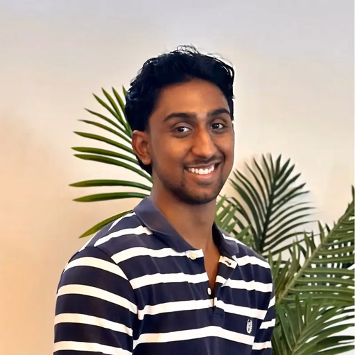 Man in striped polo shirt with palm leaves