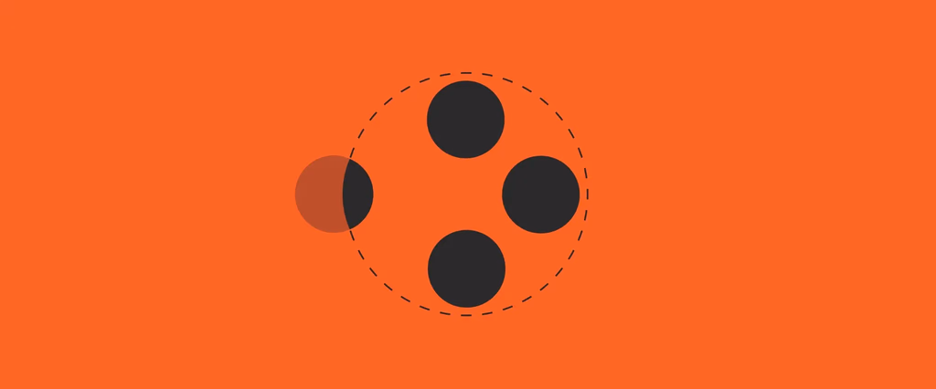 Four circular black dots arranged in a circle on orange.