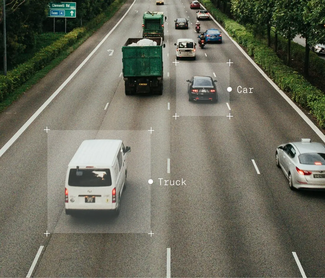 Highway with multiple vehicles, includes truck and car markers.