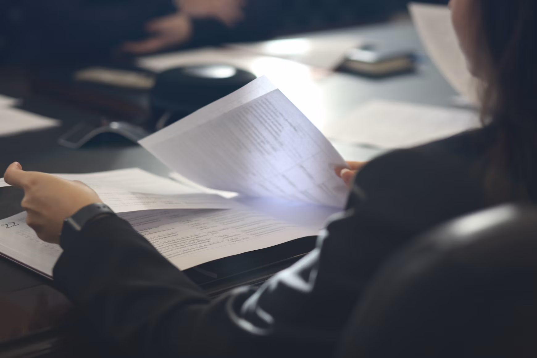 Image of woman looking at papers