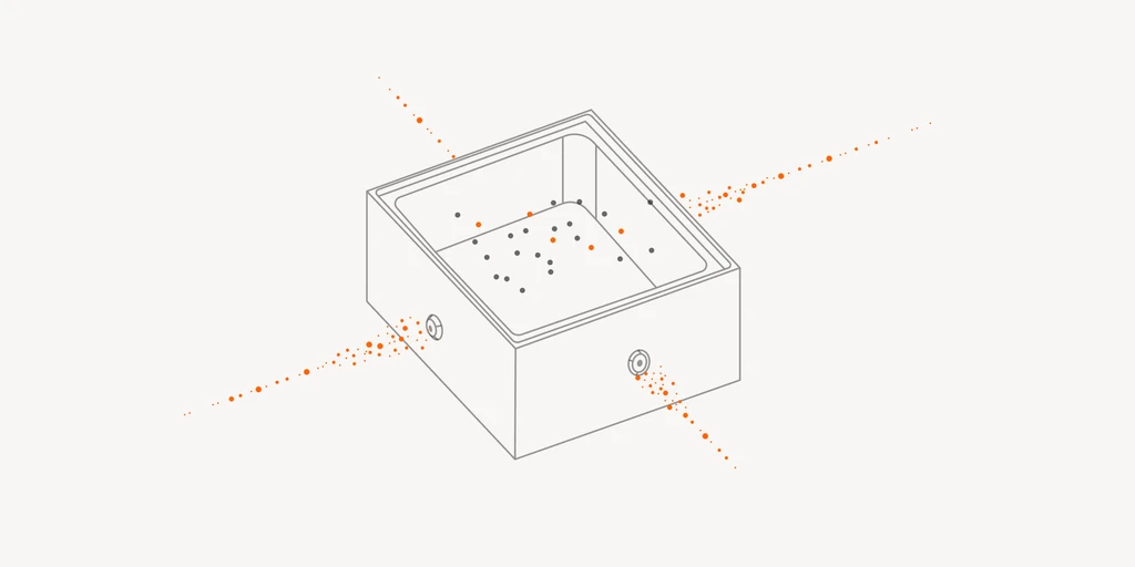 Box with dispersed particles and two circular inlets.