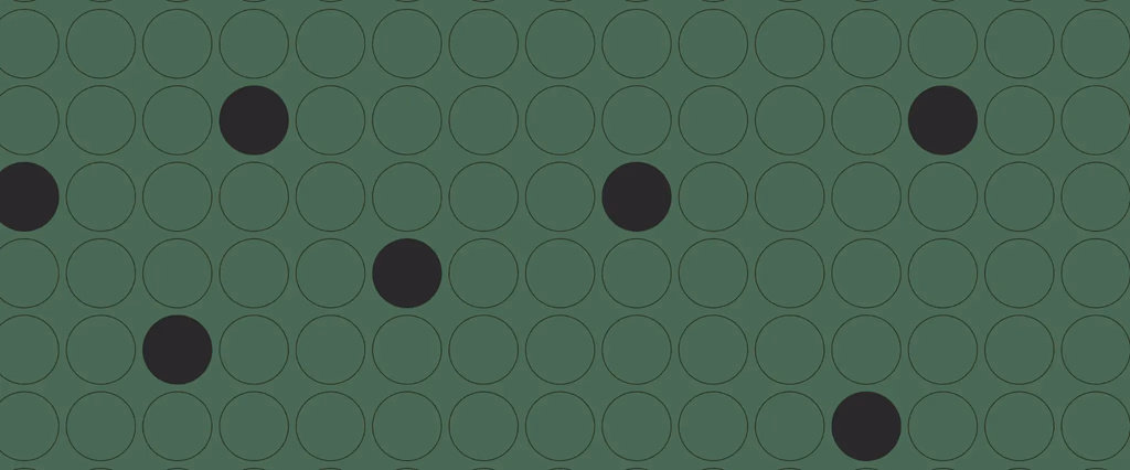 Pattern of dark circles and outlined circles on green background.