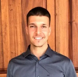 Man in blue shirt smiling